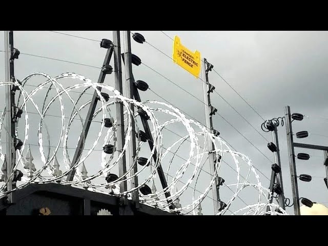 Close-up of an electric fence installation for perimeter security.